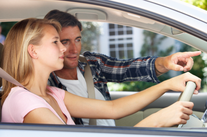 young couple driving in a car