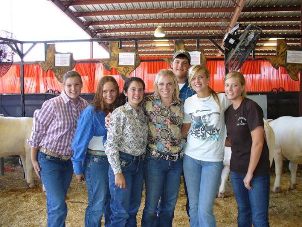Ag students in barn at show