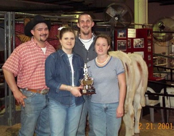 Photo: Kenny, Monica, Spence, and Jenni with their 1st place Houston Livestock Show Good Herdsman Award. This was the beginning of a long string of 1st place wins in this contest. Little did this team know at the time, their efforts would set an example that many future TVCC show teams followed.