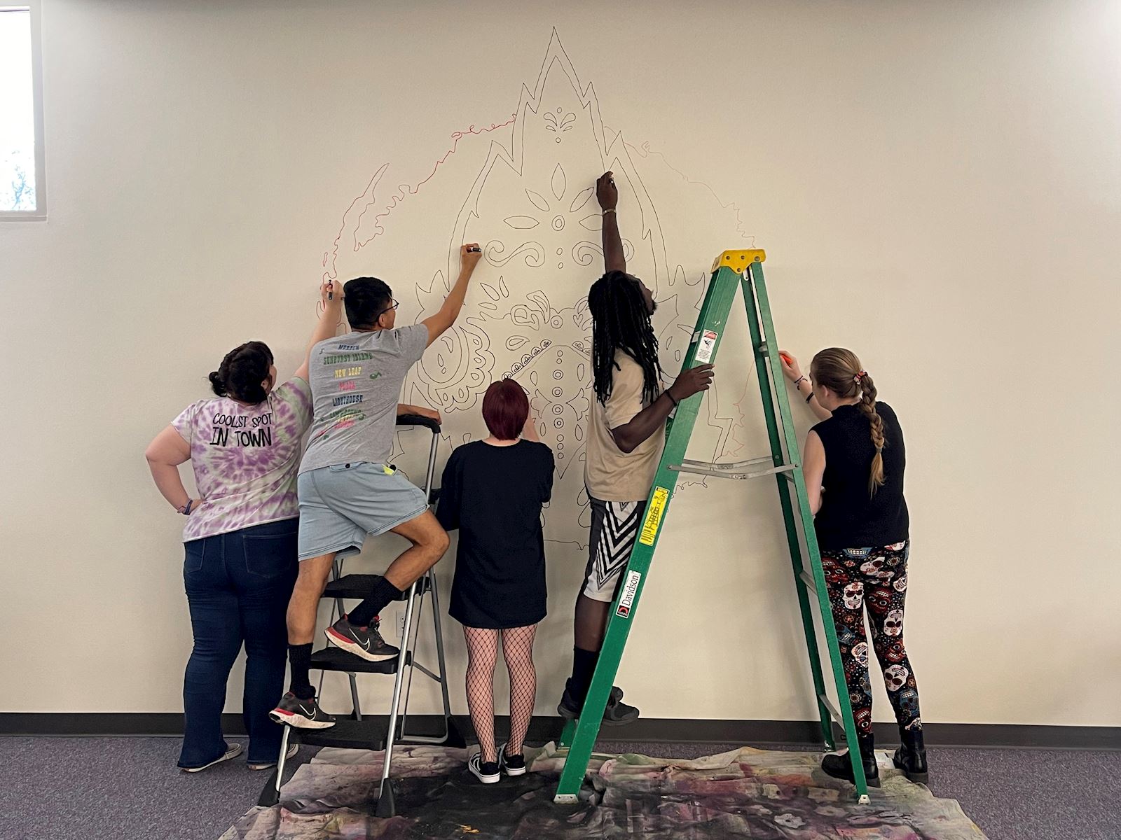 Students working on mural