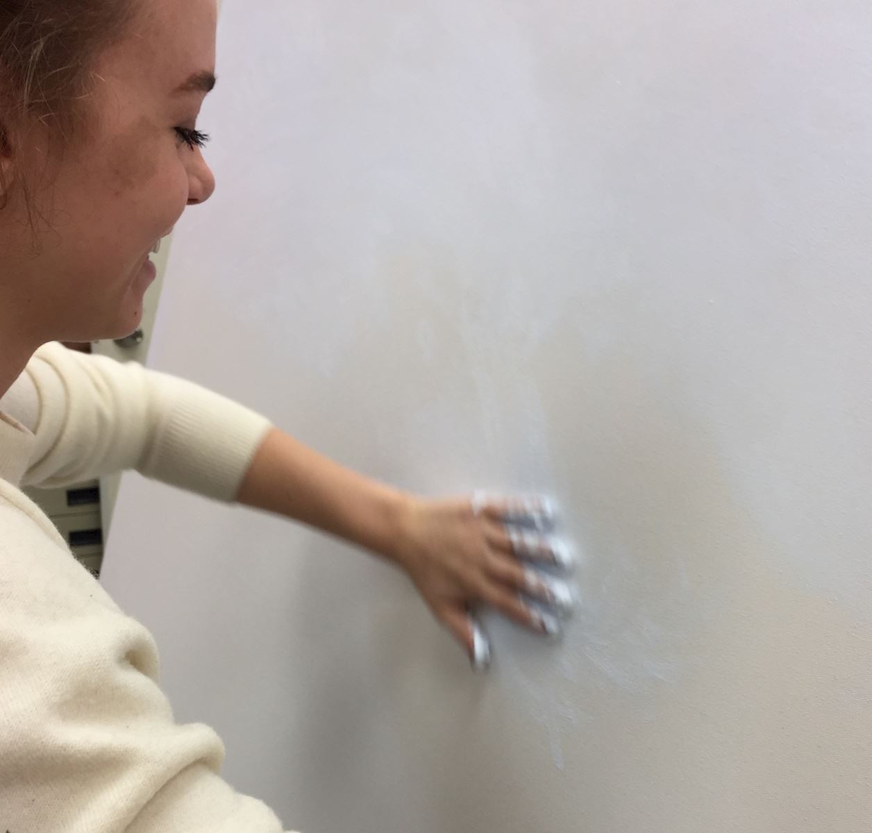 Student working on large canvas