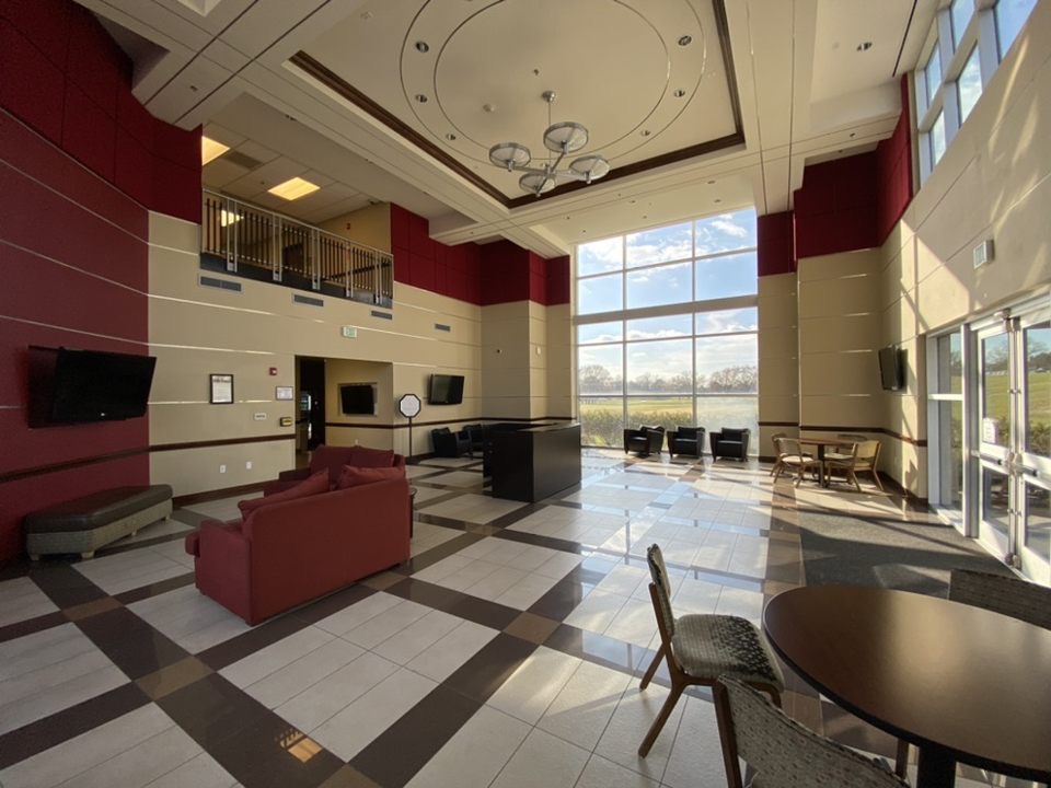 Cardinal Hall dormitory lobby with seating and window views