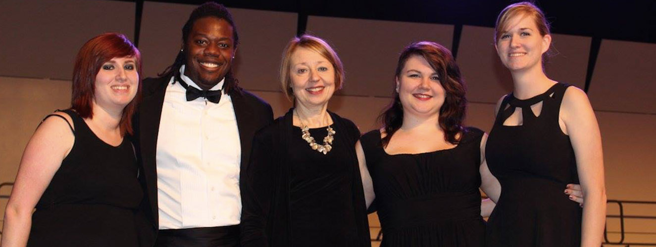 Singers in black tie attire