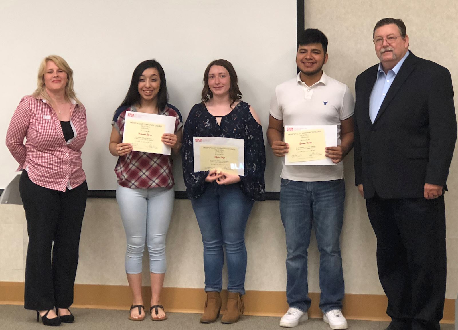 TVCC Vice President of Institutional Advancement/Foundation Executive Director and Athens Mayor Monte Montgomery flank scholarship recipients Kassandra Zapata, Abigail Angle and Gerardo Costilla.