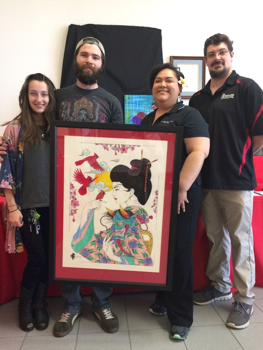 Shellsea Conn, artist Ashton Neher, auction winner Russann Cortez, TVCC IT Systems Administrator Robert Janeway.