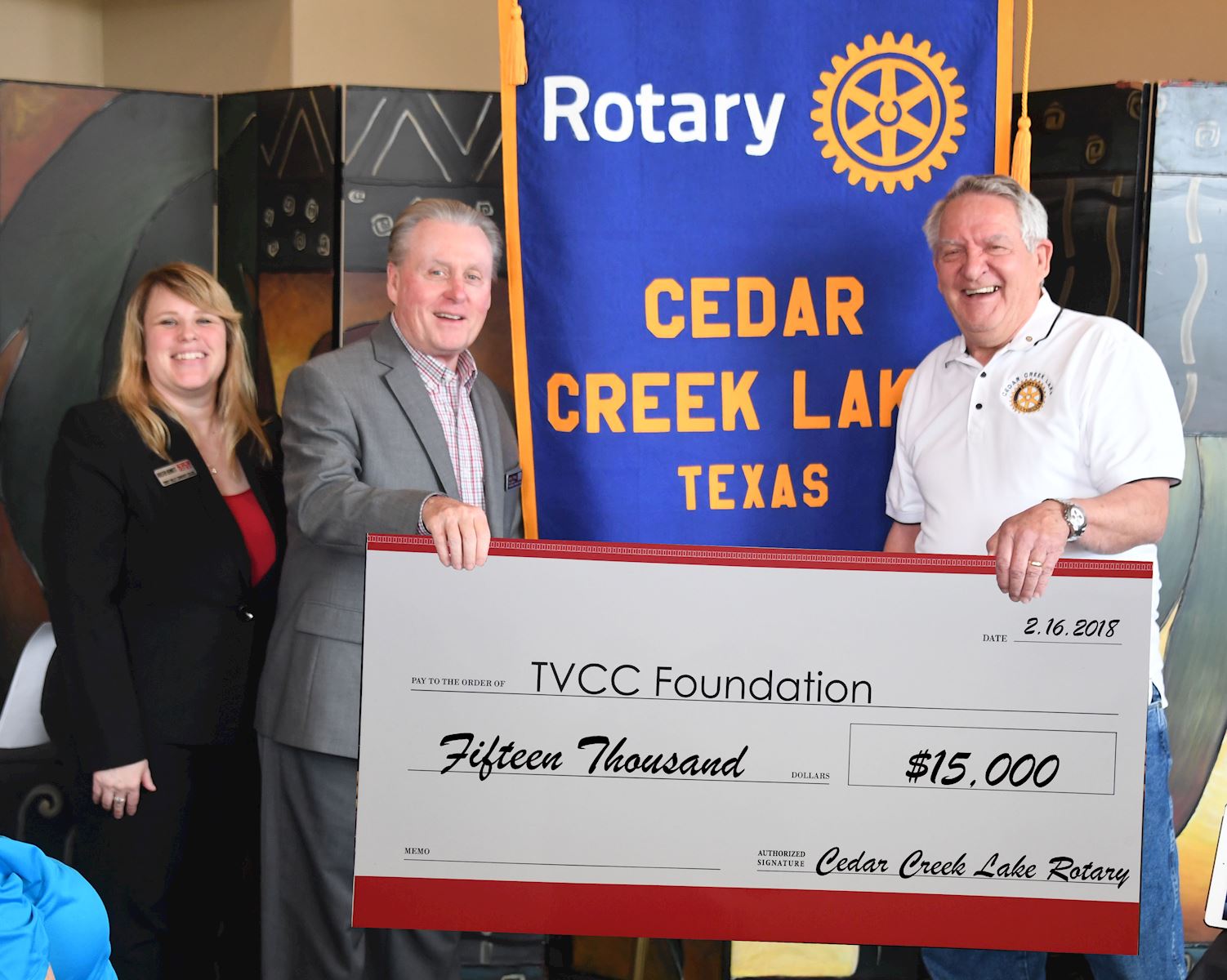 TVCC Vice President of Institutional Advancement/TVCC Foundation Executive Director Dr. Kristen O. Bennett and TVCC President Dr. Jerry King accept the big check from Cedar Creek Lake Rotary Club President Bill Burnett.