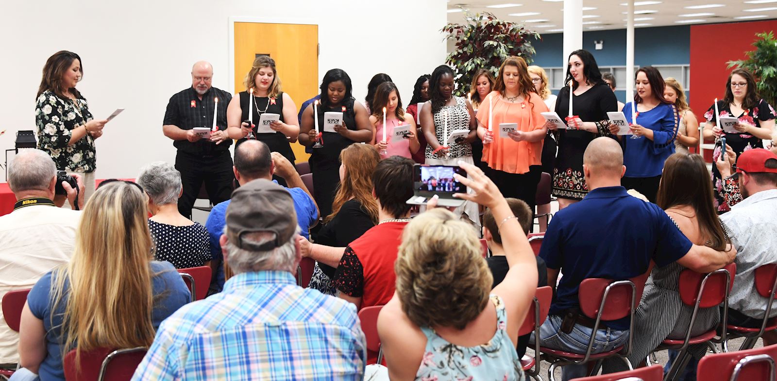 Newly pinned nurses recite the Florence Nightingale Pledge