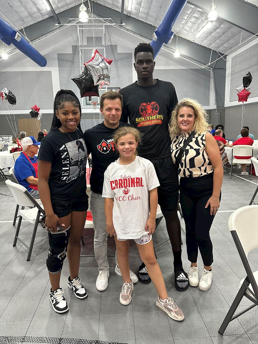 Dr. Morrison with his family and Friends of the Cardinals students. Dr. Morrison with his family and Friends of the Cardinals students.