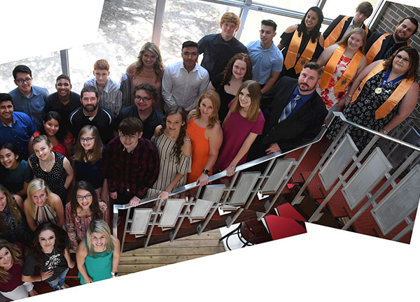 Inductees group on staircase                                                                                                                