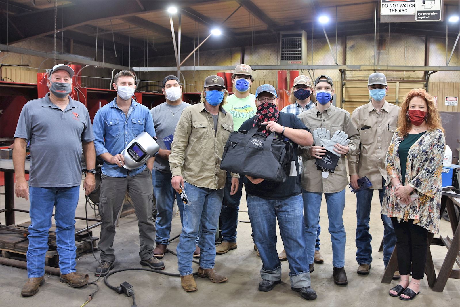 New welding students receive starter kits. Pictured, from left, Tom Sheram, TVCC welding instructor Shawn Chancellor, Flint Nicholas Pinto, Kaufman Brady Griffin, Canton Jarrett Riley, Frankston Shane Hughes, Frankston Tucker Cline, Eustace Eric Pierce, Palestine Tyler Autry, Canton Associate Vice President of Workforce Education Kelley Townsend.