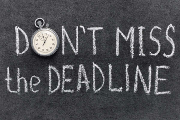Chalkboard with Dont Miss the Deadline written in chalk Chalkboard with Dont Miss the Deadline written in chalk