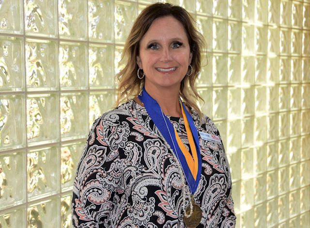 Wendy Elmore, Ed.D. with PTK Distinguished College Administrator Medals
