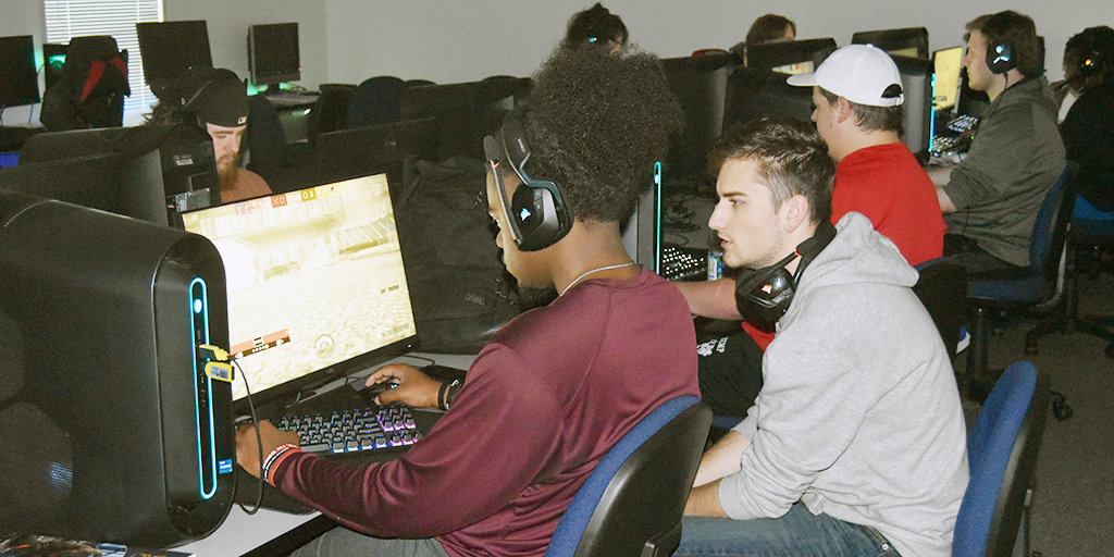 Tristan Woods (WoodsX22) and Josiah Long (PandaX) discuss pre-game strategy during a practice session at the TVCC Esports lab.              