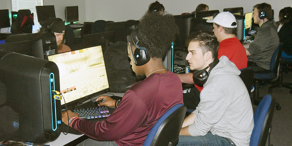 Tristan Woods (WoodsX22) and Josiah Long (PandaX) discuss pre-game strategy during a practice session at the TVCC Esports lab.