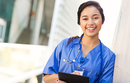 smiling young woman in medical smock