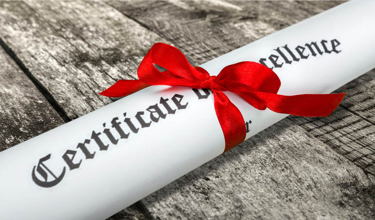rolled certificate tied with a red ribbon