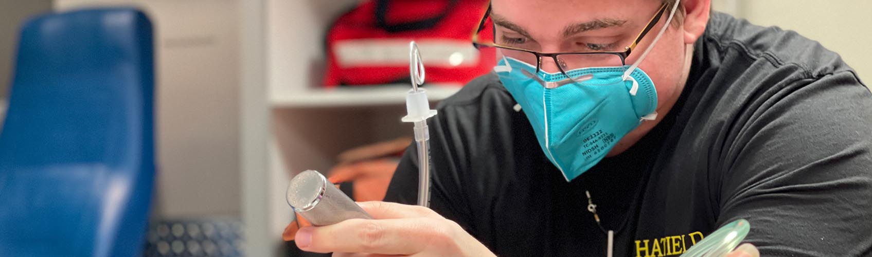 Woman nursing student working on simulated patient