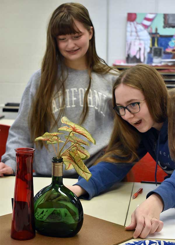 Two students having fun in art class