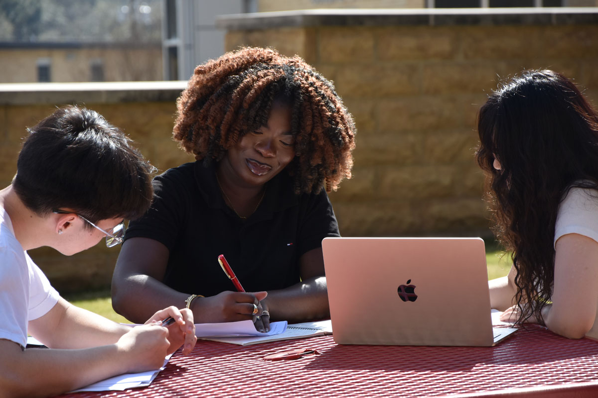 Students sitting a table studying together