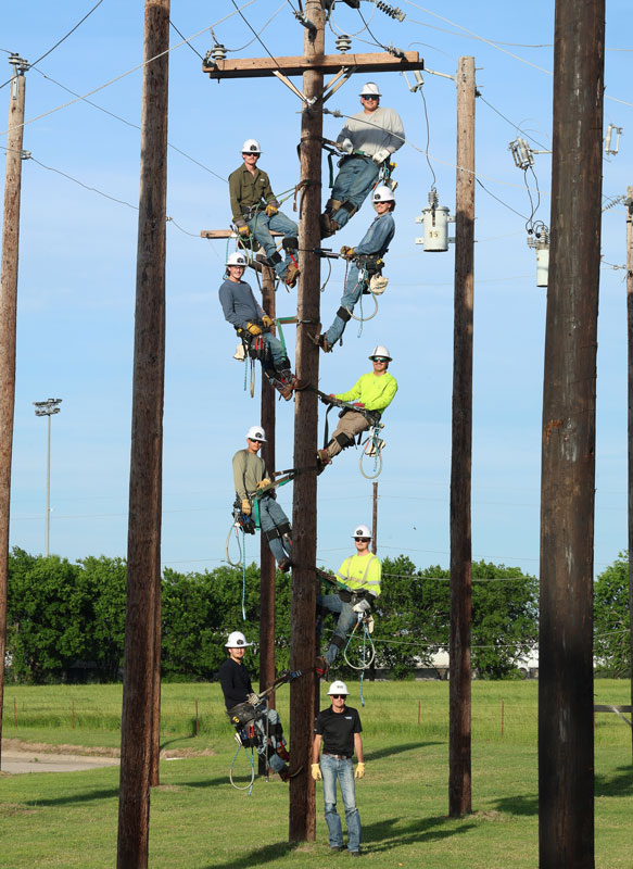 Electrical lineworker grounds at the Palestine campus at night