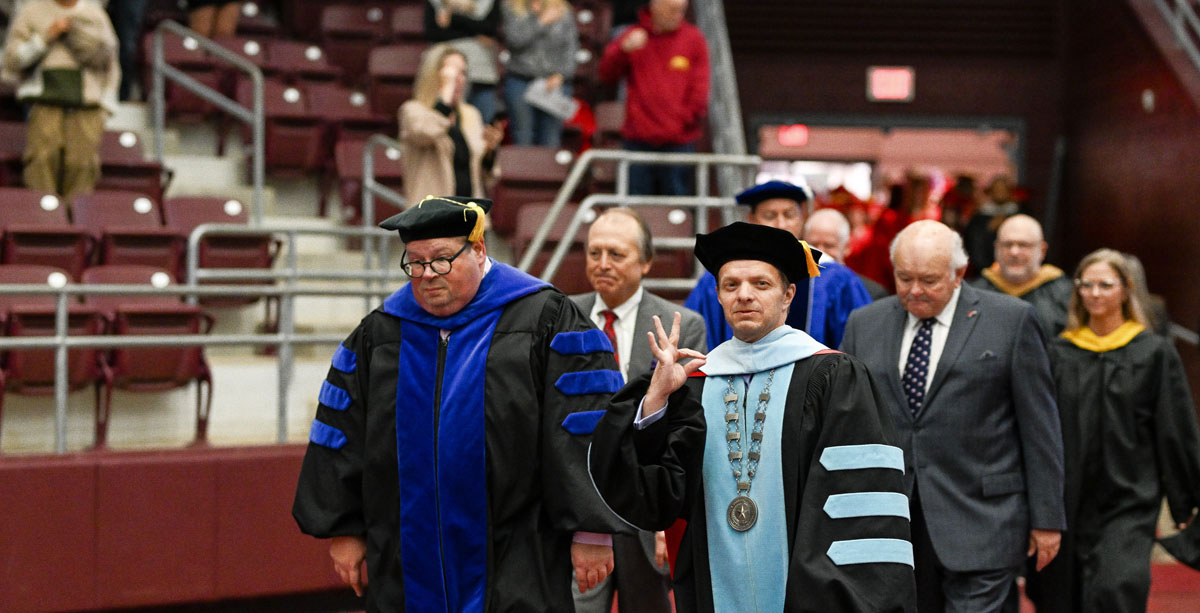 President Dr. Jason Morrison walking with other TVCC institutional leaders at a graduation ceremony