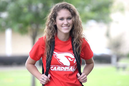 Young woman with backpack smiling