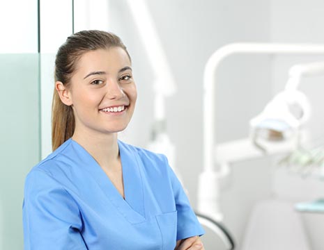smiling young lady in nursing smock