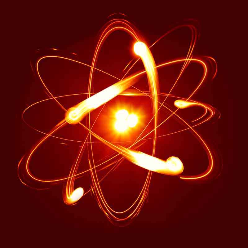 An atom with electrons spinning around it
