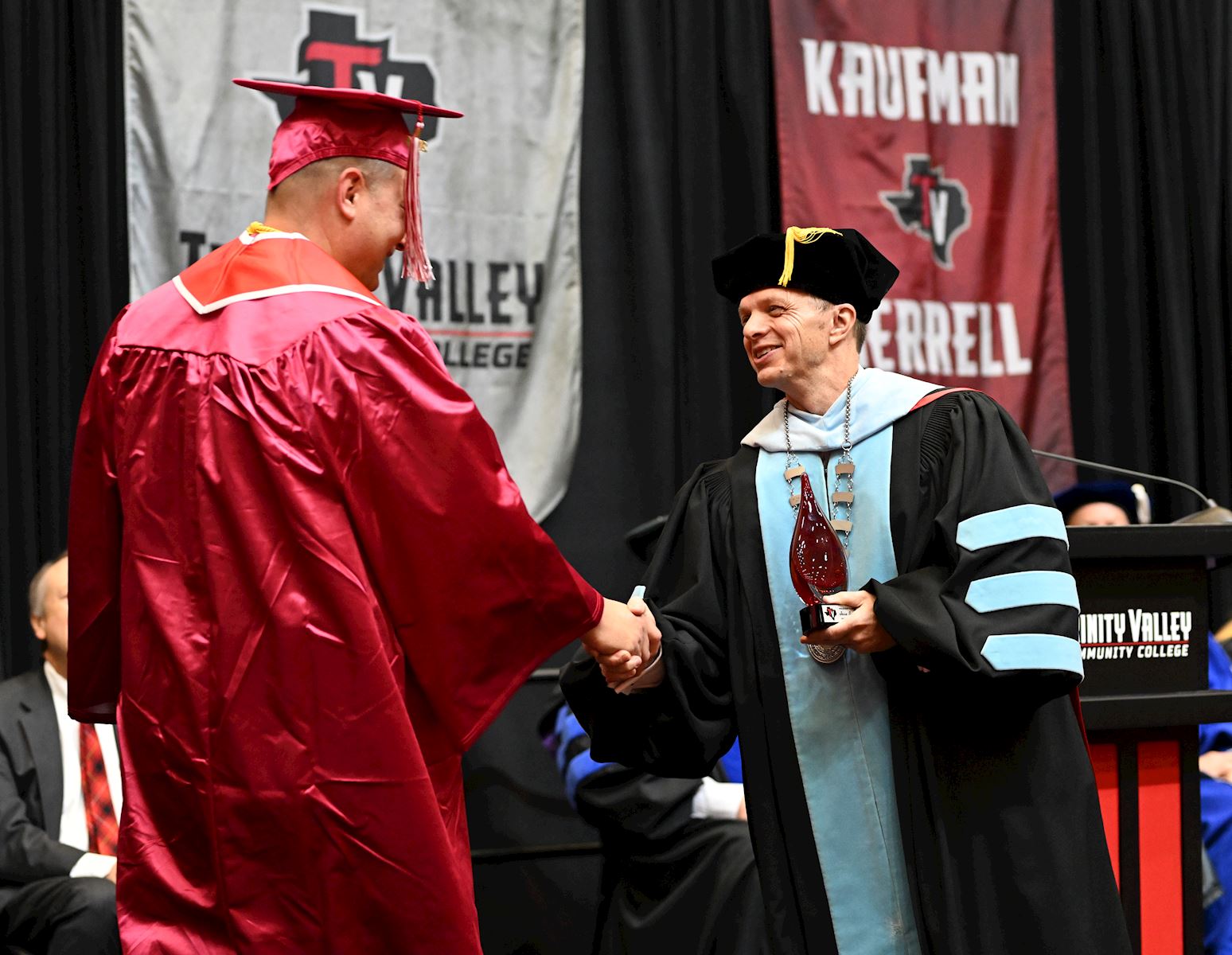 TVCC President congratulations TVCC graduate.                                                                                               
