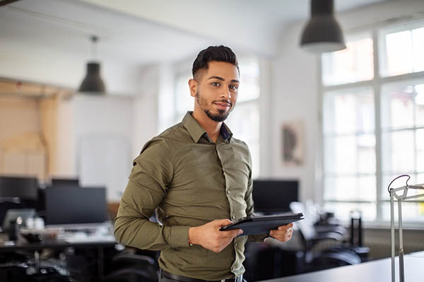 man holding a laptop